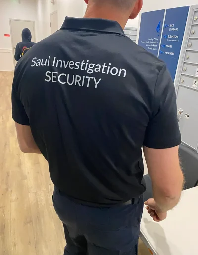 Saul Investigations guard in foyer