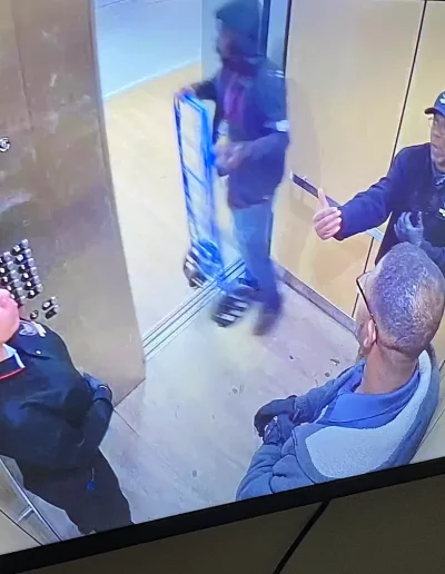 guards in elevator on cam