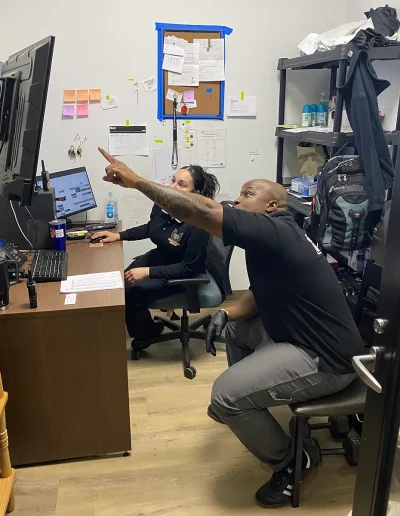 security guards pointing at screen